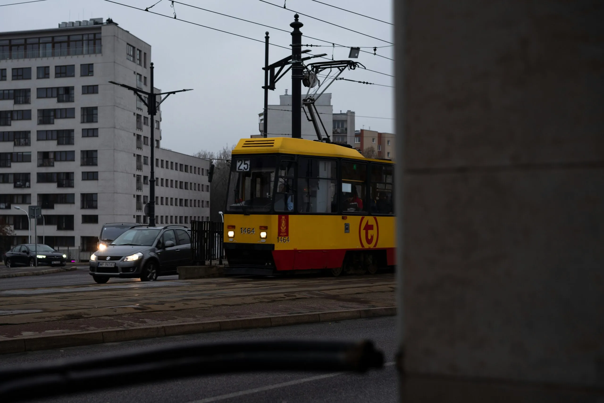 a yellow and red train traveling down train tracks