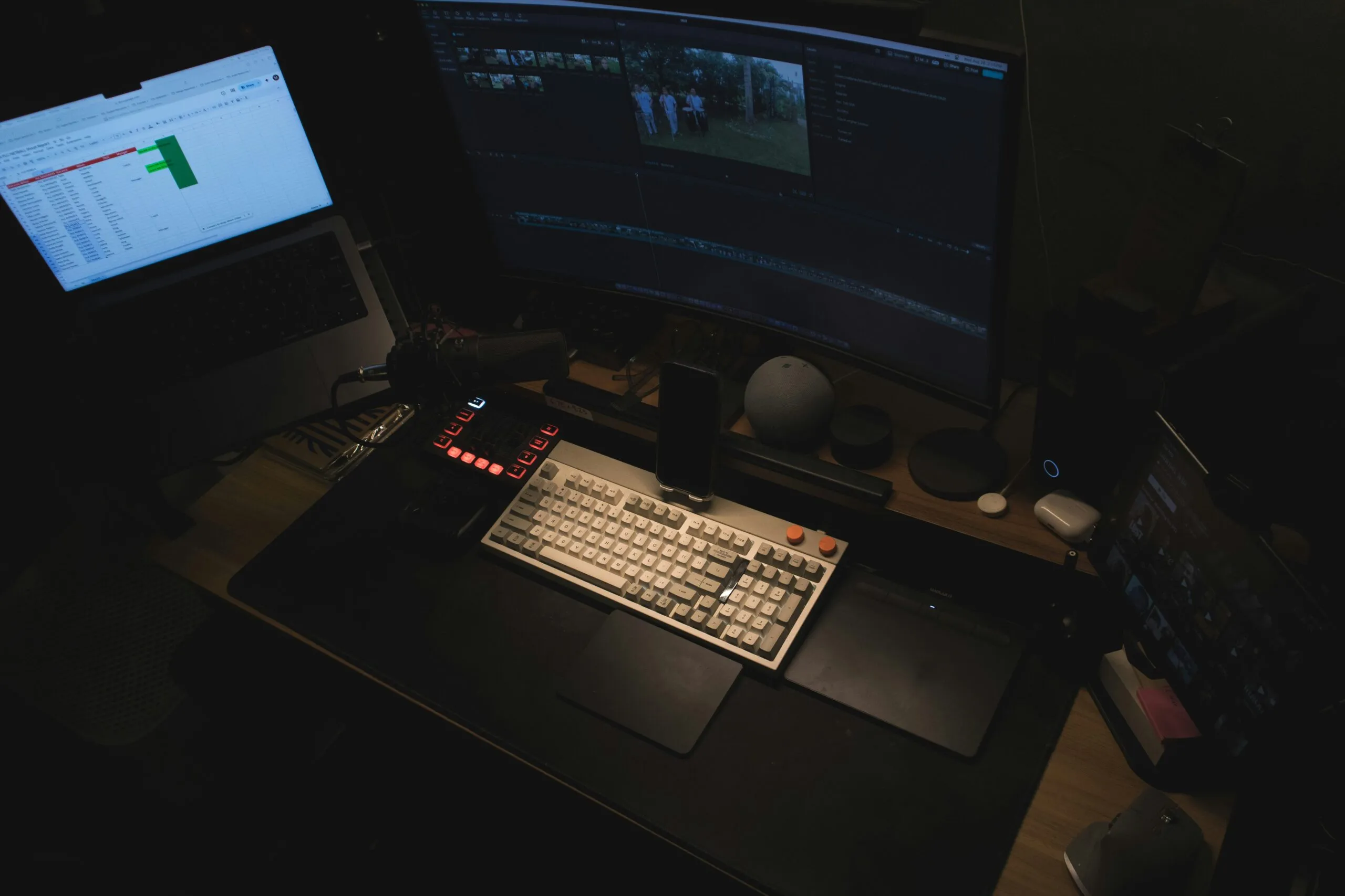 A computer desk with two monitors and a keyboard