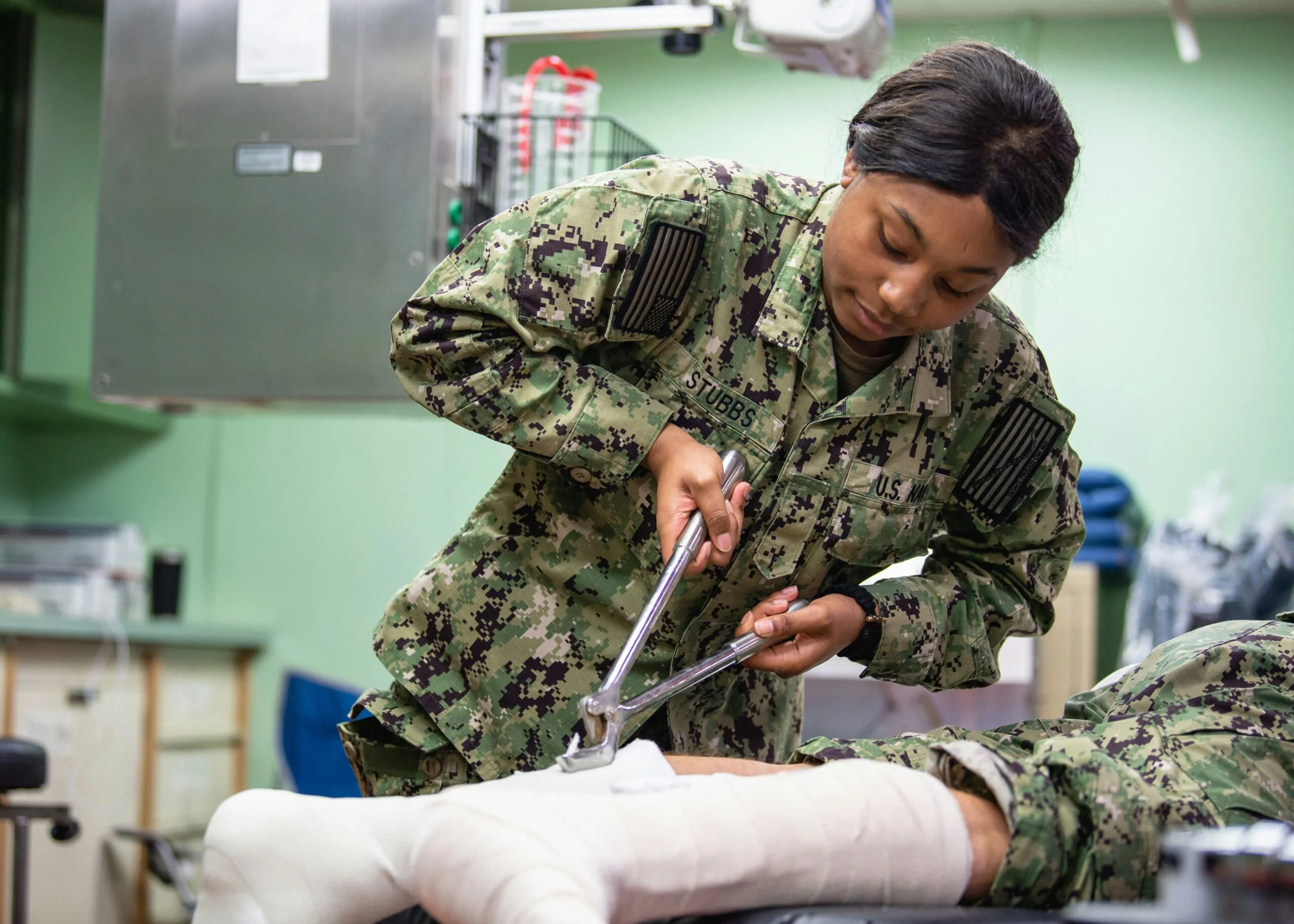 200404-N-PH222-1138 LOS ANGELES (April 4, 2020) Hospitalman Kiana Stubbs, from Chicago, practices removing a cast during orthopedics training aboard the hospital ship USNS Mercy (T-AH 19). Mercy deployed in support of the nation's COVID-19 response efforts, and will serve as a referral hospital for non-COVID-19 patients currently admitted to shore-based hospitals. This allows shore base hospitals to focus their efforts on COVID-19 cases. One of the Department of Defense's missions is Defense Support of Civil Authorities. DoD is supporting the Federal Emergency Management Agency, the lead federal agency, as well as state, local and public health authorities in helping protect the health and safety of the American people. (U.S. Navy photo by Mass Communication Specialist 2nd Class Ryan M. Breeden)