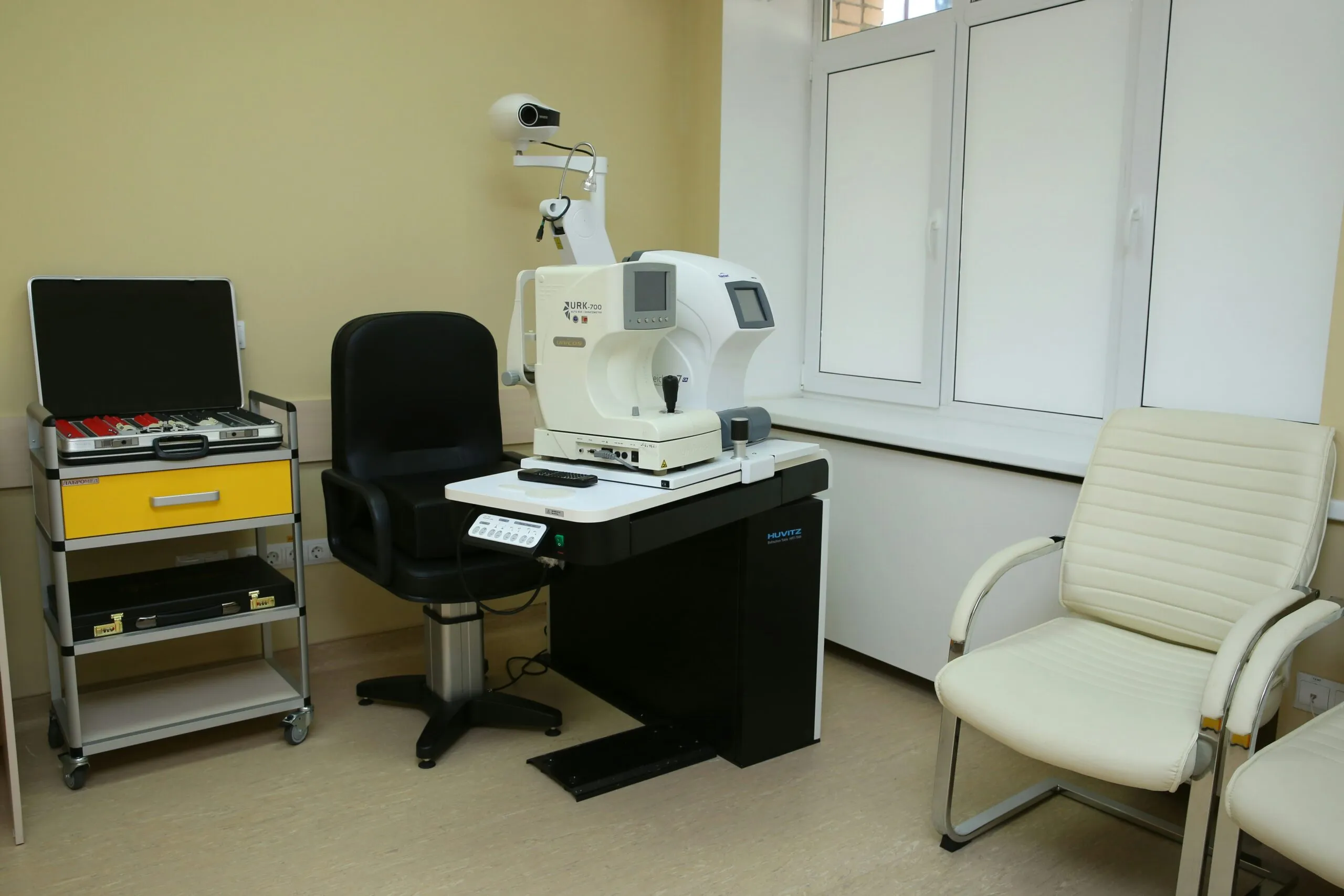a room with a microscope and a chair