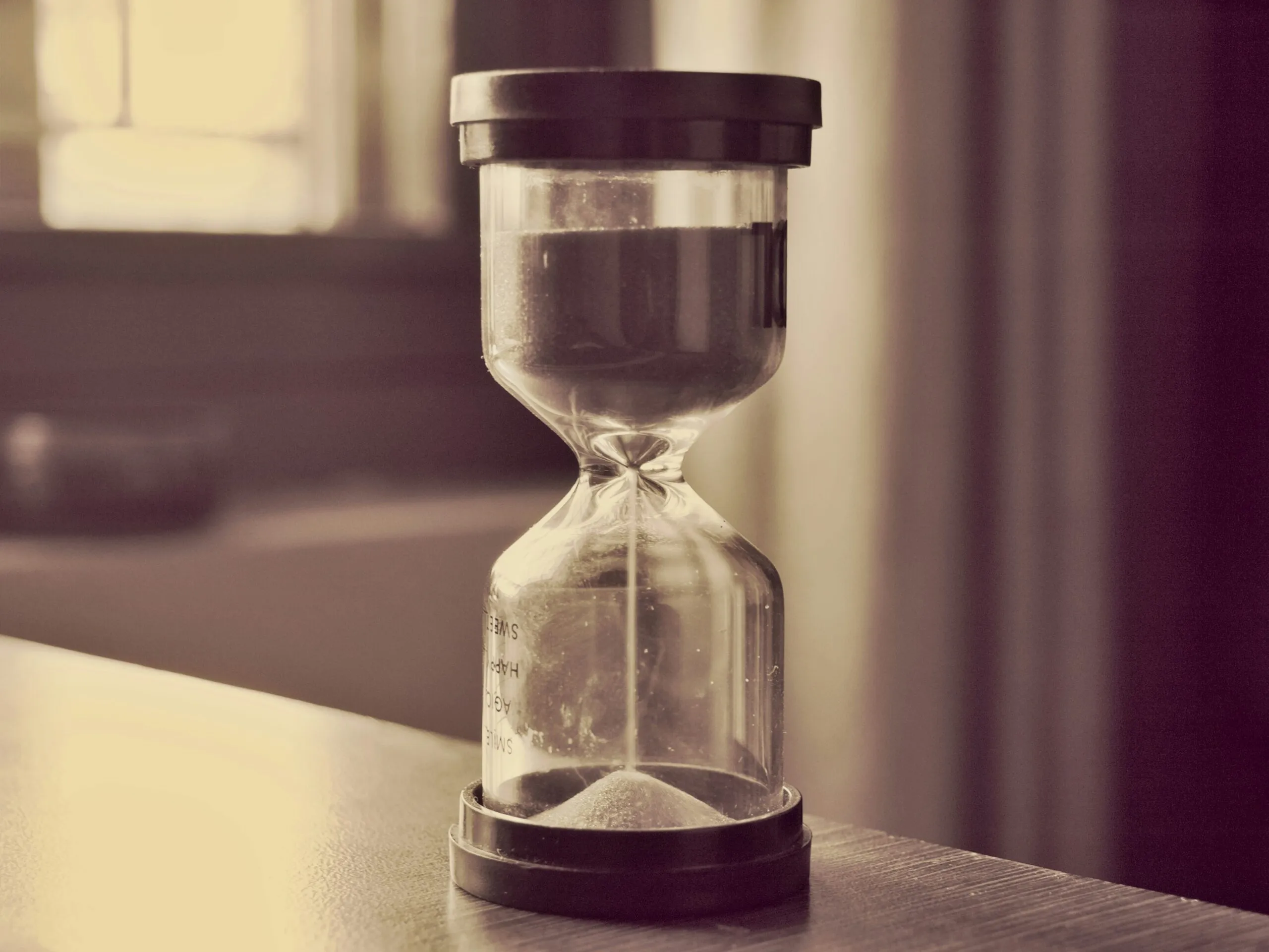 An hourglass counts down time.