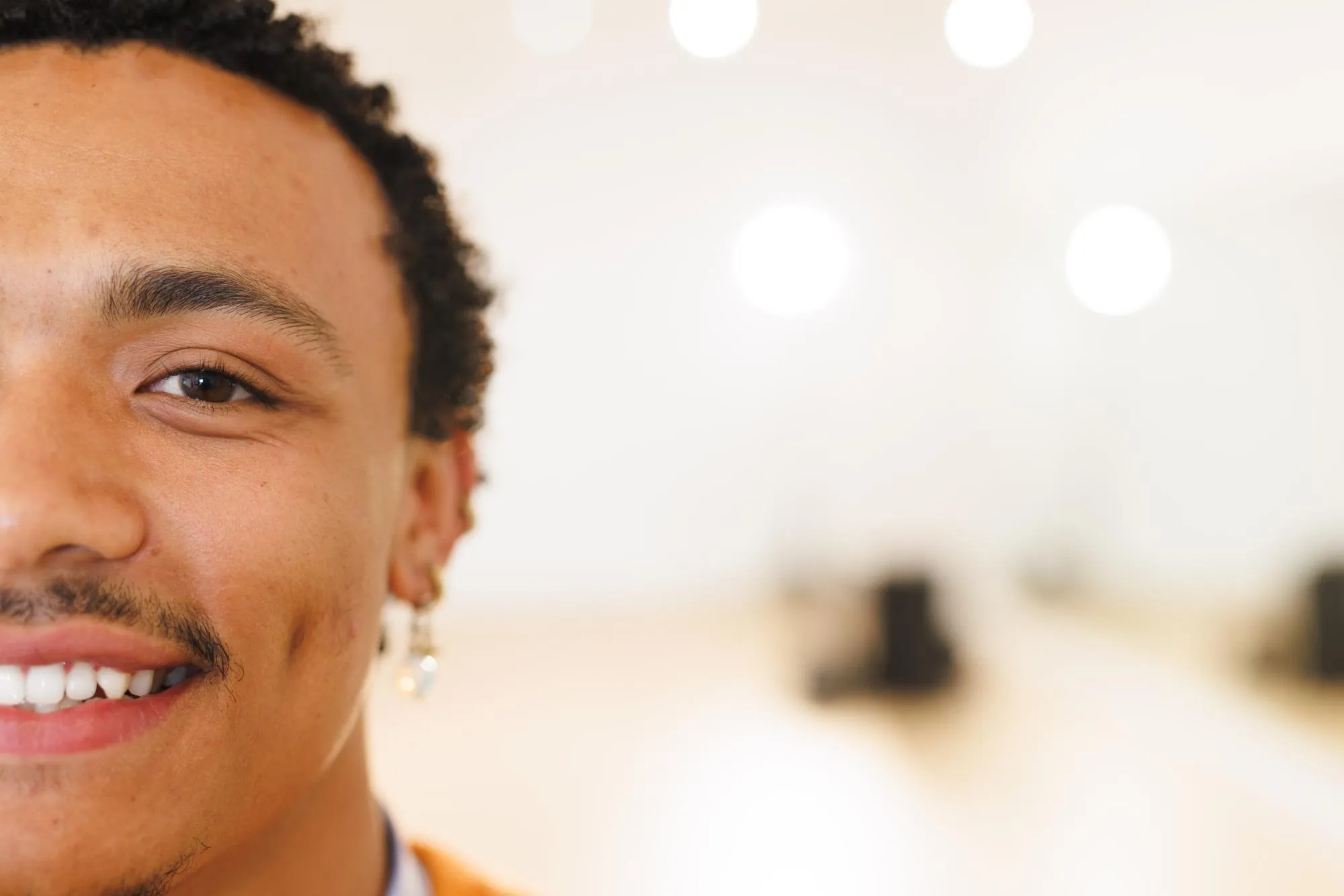 Image of happy biracial male hip hop dancer posing to camera with copy space. Dance, rhythm, movement and training concept.