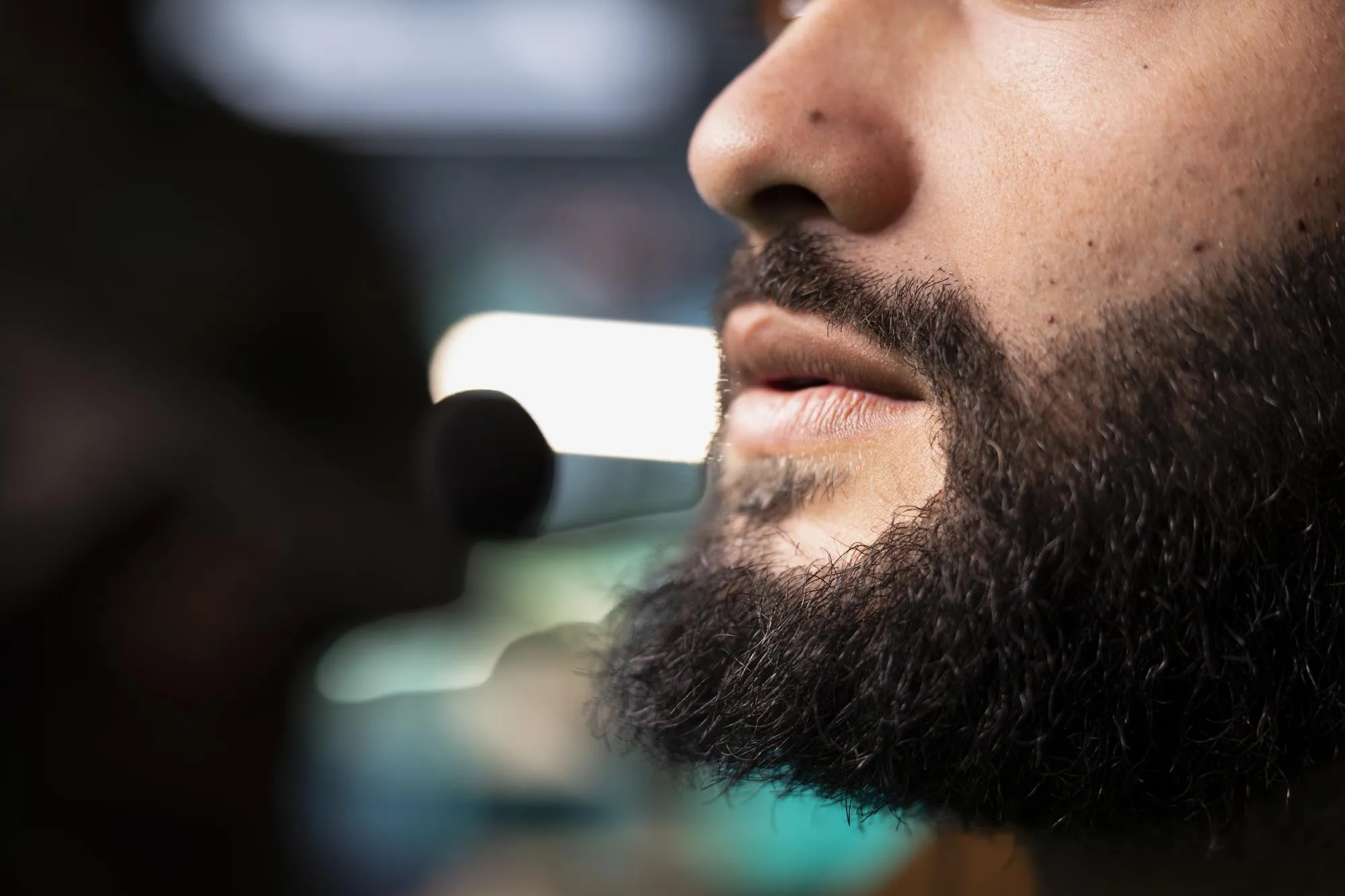 Intelligence agency expert using headset mic to call in air strikes on enemy troops close up of