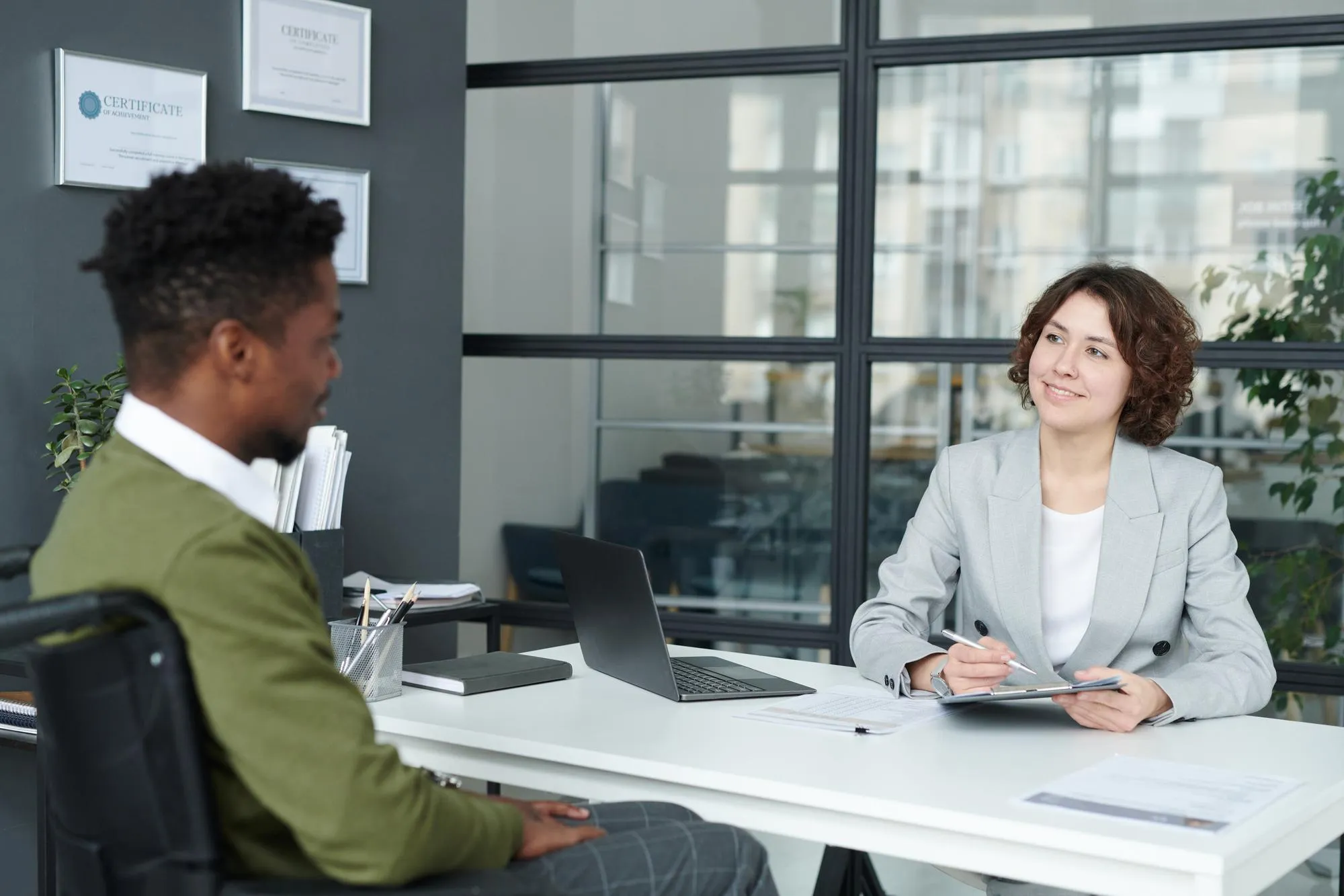 Manager talking to candidate with disability