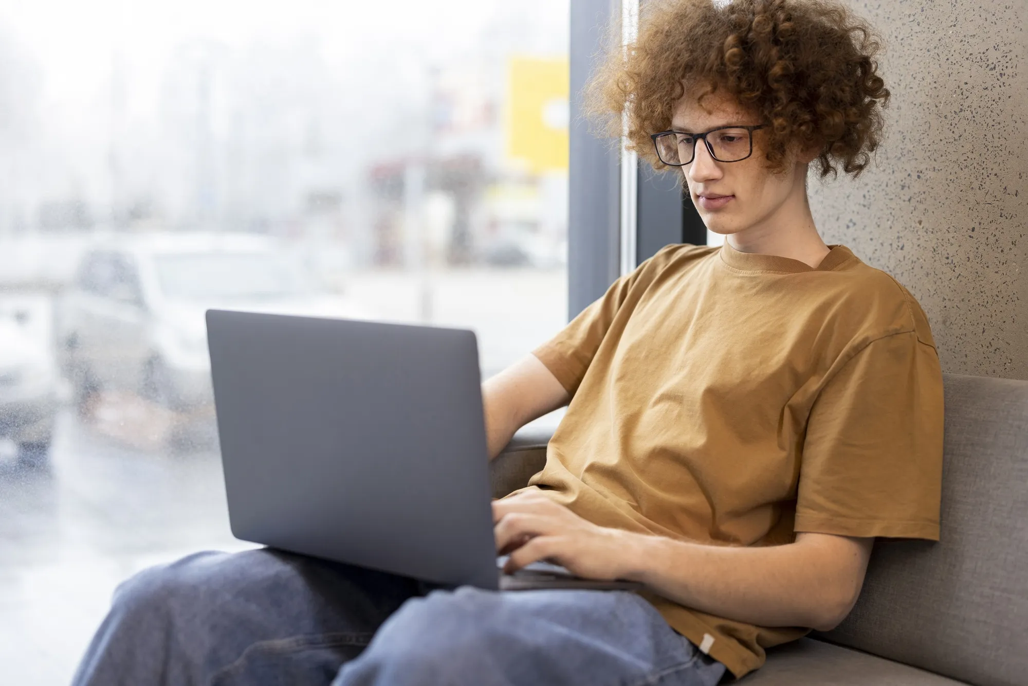 Medium shot man reading digital magazine