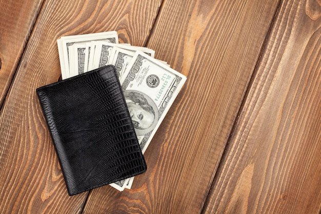 Money cash wallet on wooden table