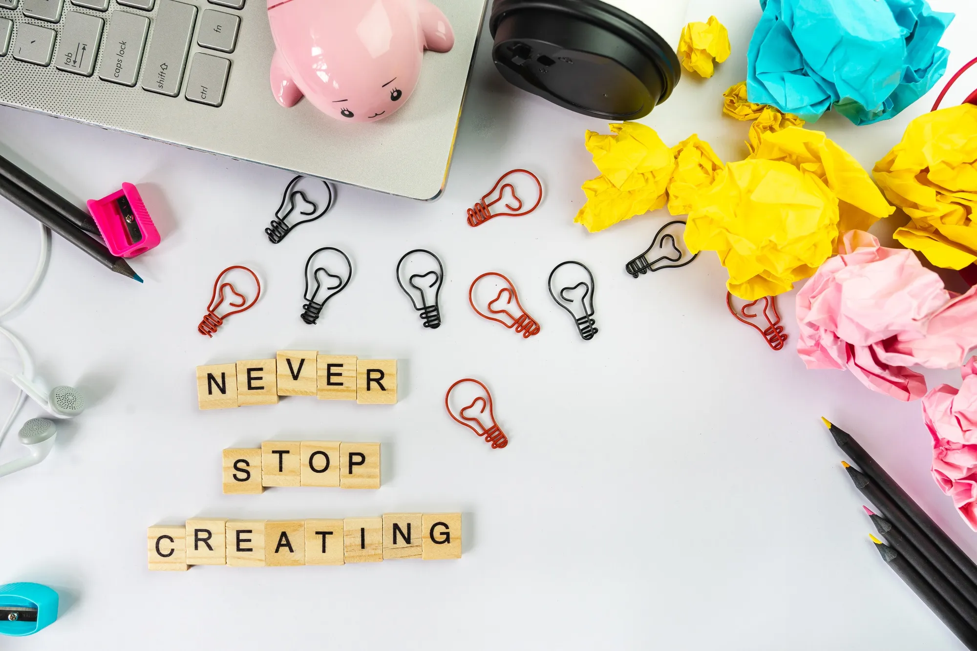 Never stop creating word on wooden block, creative idea concept 