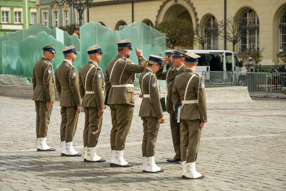 Polish military personnel in uniform at a parade in Wrocław, Poland.