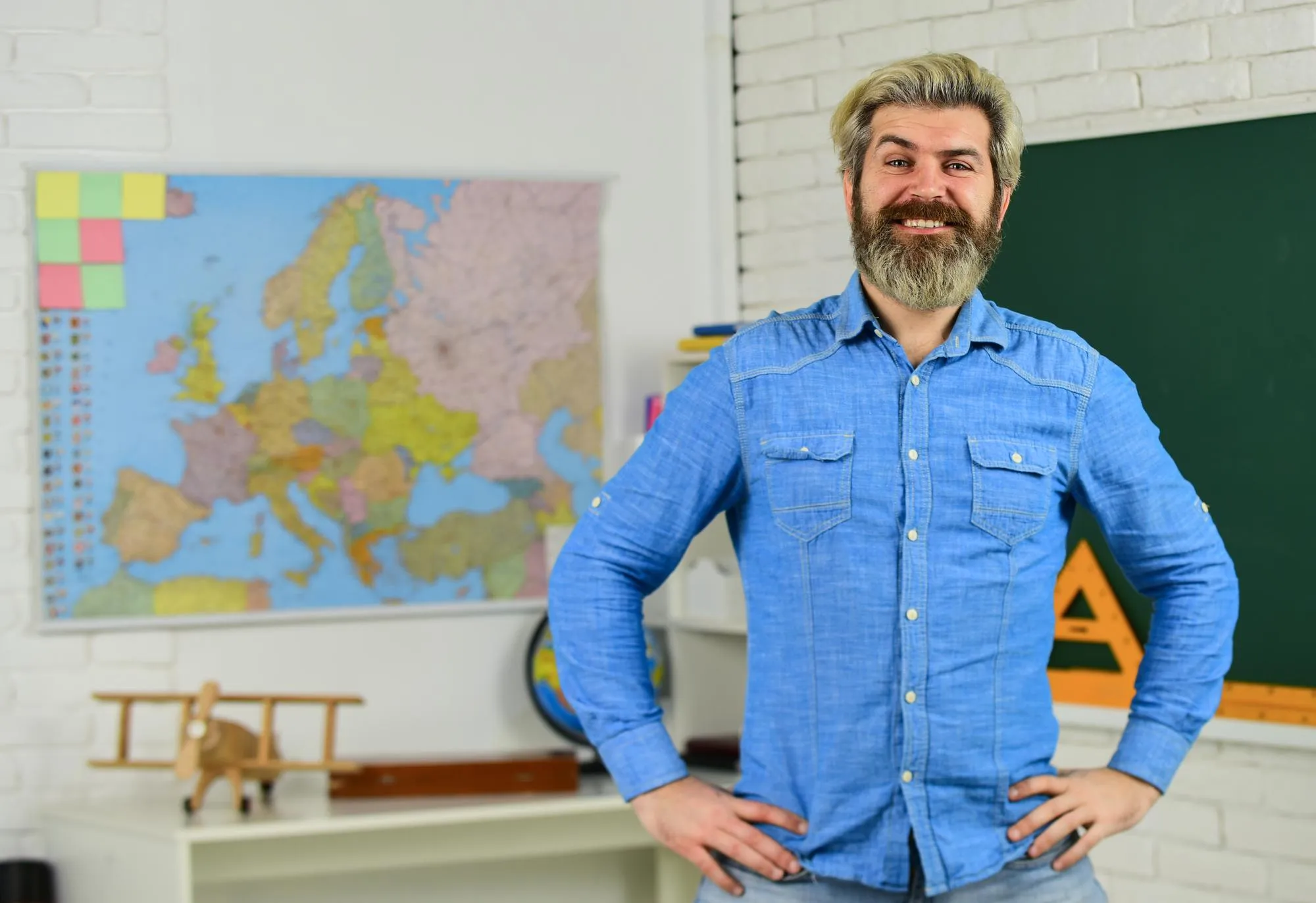 School subject History and geography Science concept Mature bearded teacher in classroom Private lesson Back to school Study with interest Man mentoring school projects Basic education
