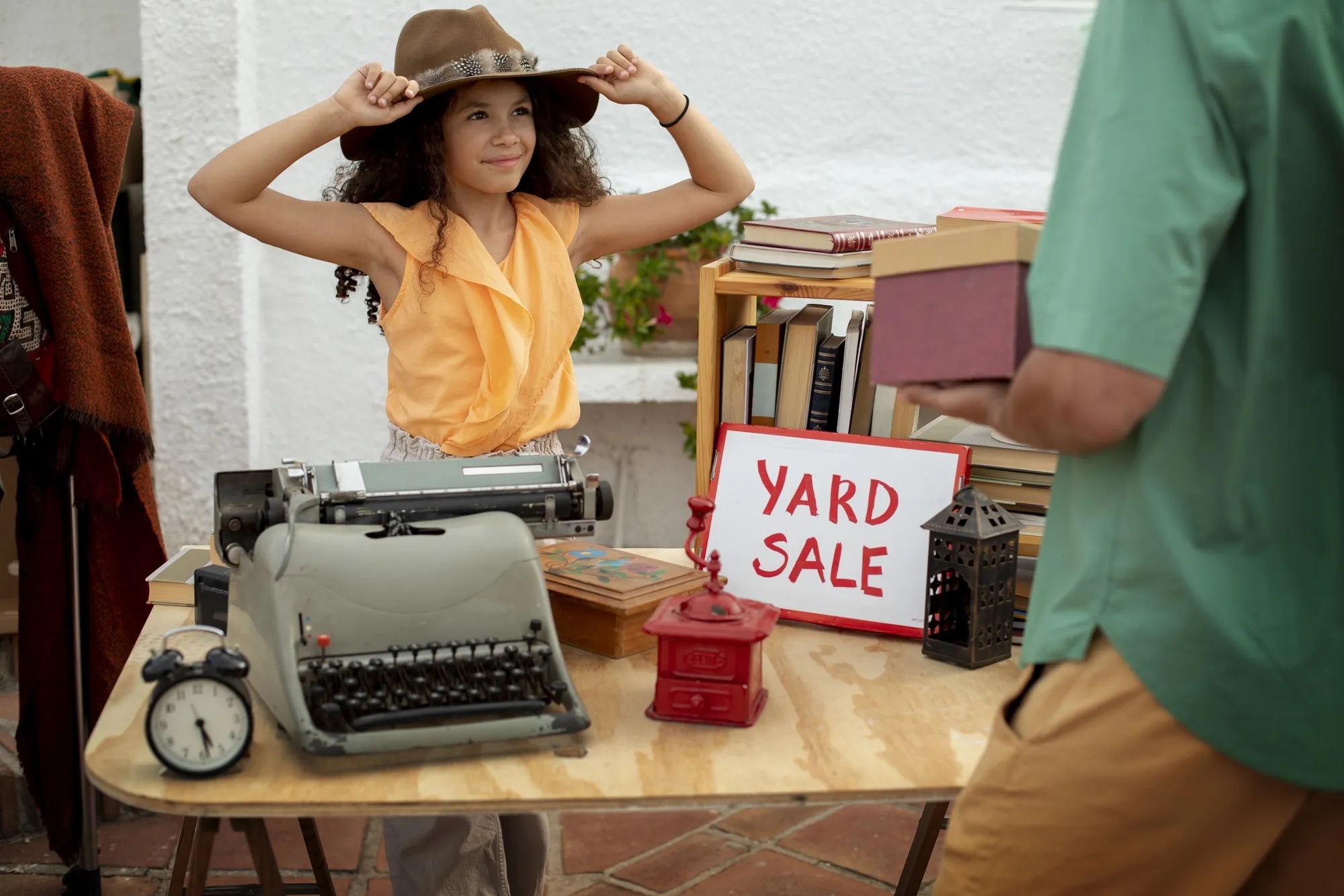 Side view man and girl at garage sale