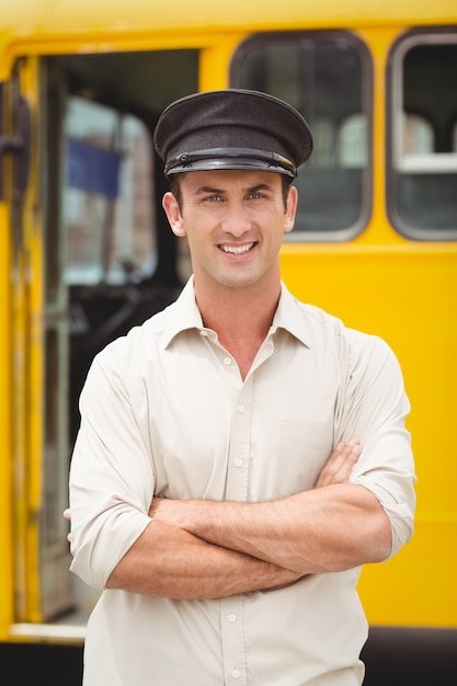Smiling bus driver looking at camera