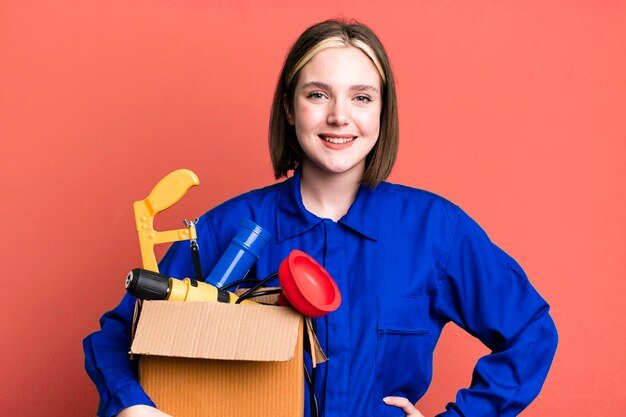 Smiling happily with a hand on hip and confident