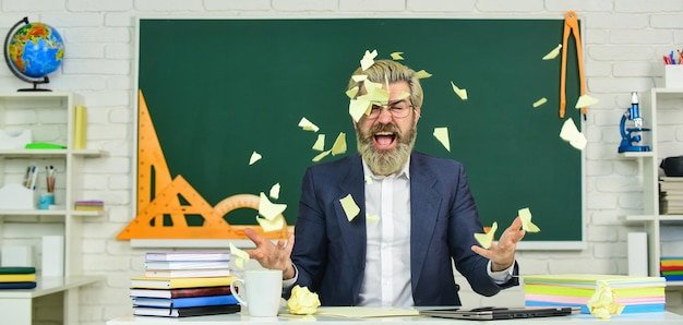 Teacher destroying paper file. Get free education. Destroy profile documents. Study hard. School education for everyone. Modern education requirements. Private school advertising boost enrollments.