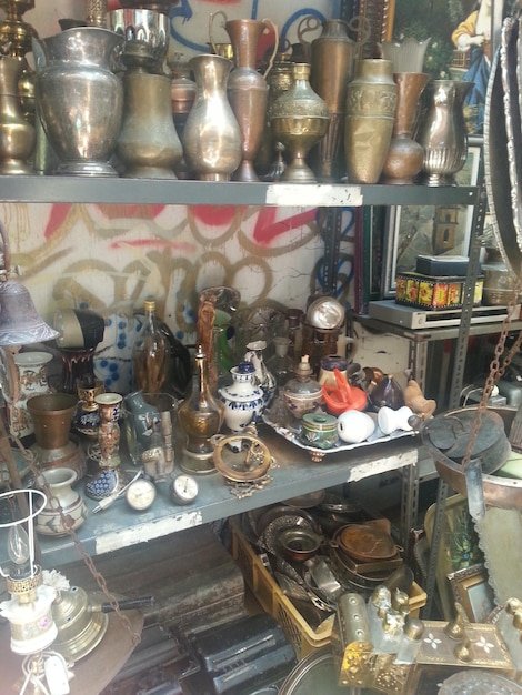 Various antique equipment for sale at market stall