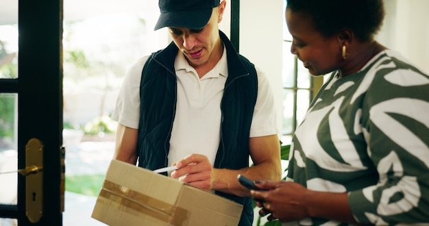 Woman courier and phone for box at front door home and invoice for payment deal or online order People delivery man and customer with package info and ecommerce services with smile at apartment