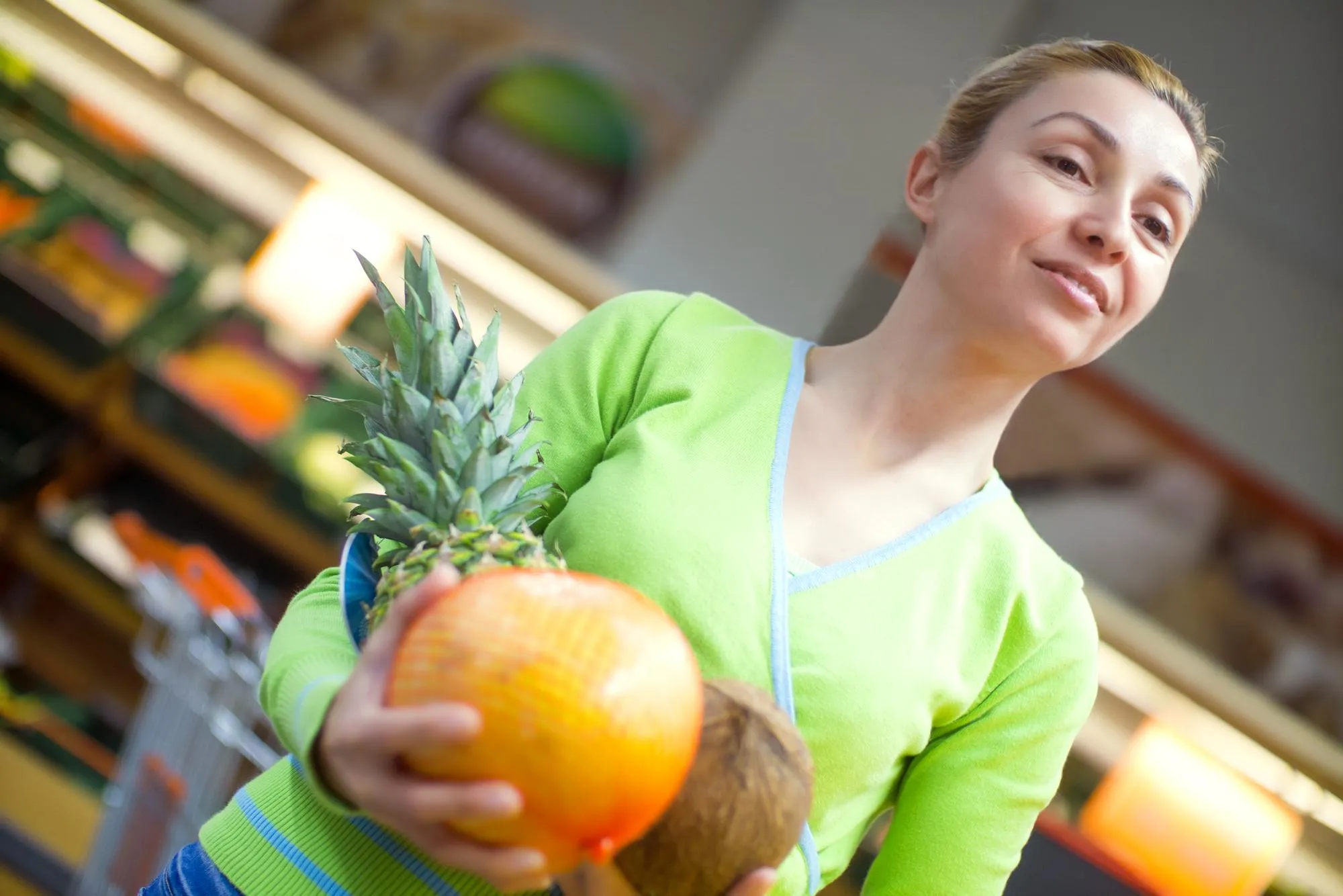 Woman doing shopping of merchandise in supermarket
