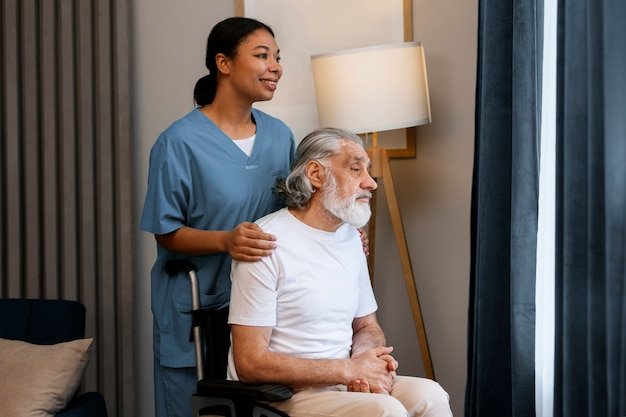 Woman taking care of old man