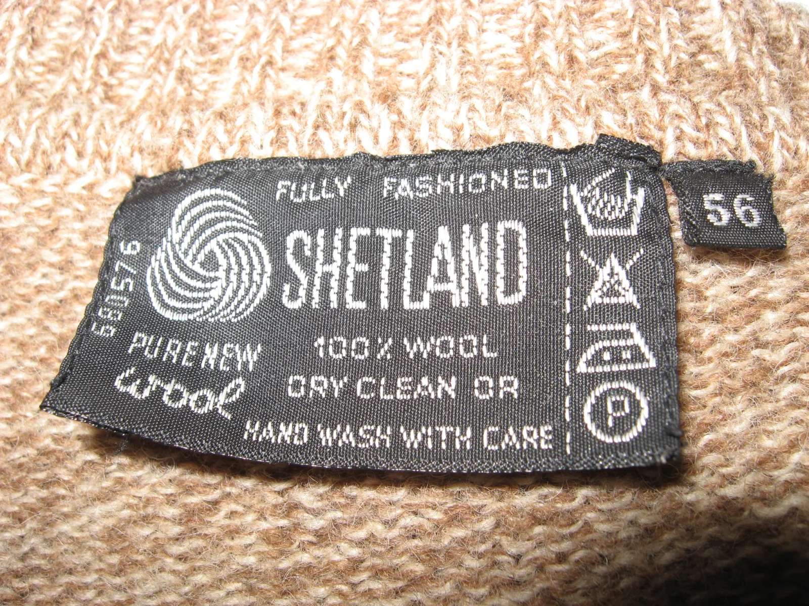 Label with care symbols on a wool sweater