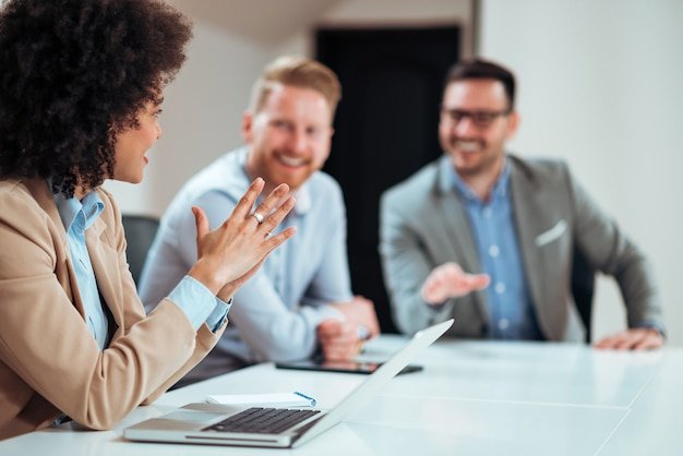 Business woman putting forward his suggestions to colleagues.