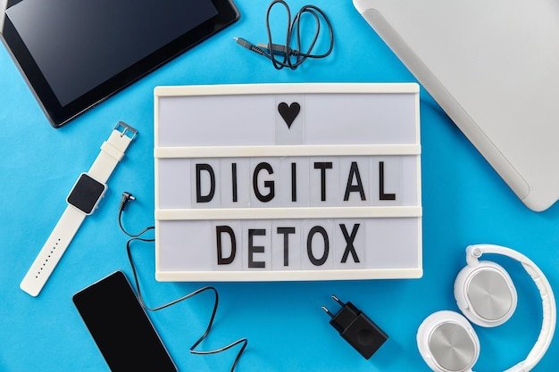 gadgets and digital detox words on light box