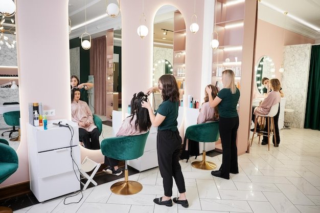 Hairdressers and makeup artist working in beauty salon