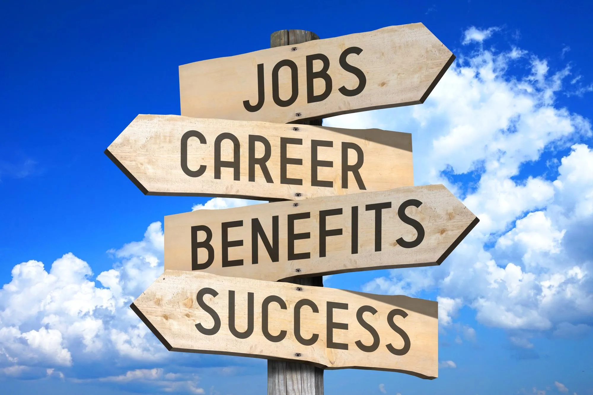 Jobs career benefits success wooden signpost with four arrows sky with clouds in background