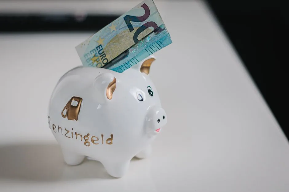 A white piggy bank with a €20 note inserted, symbolizing savings.