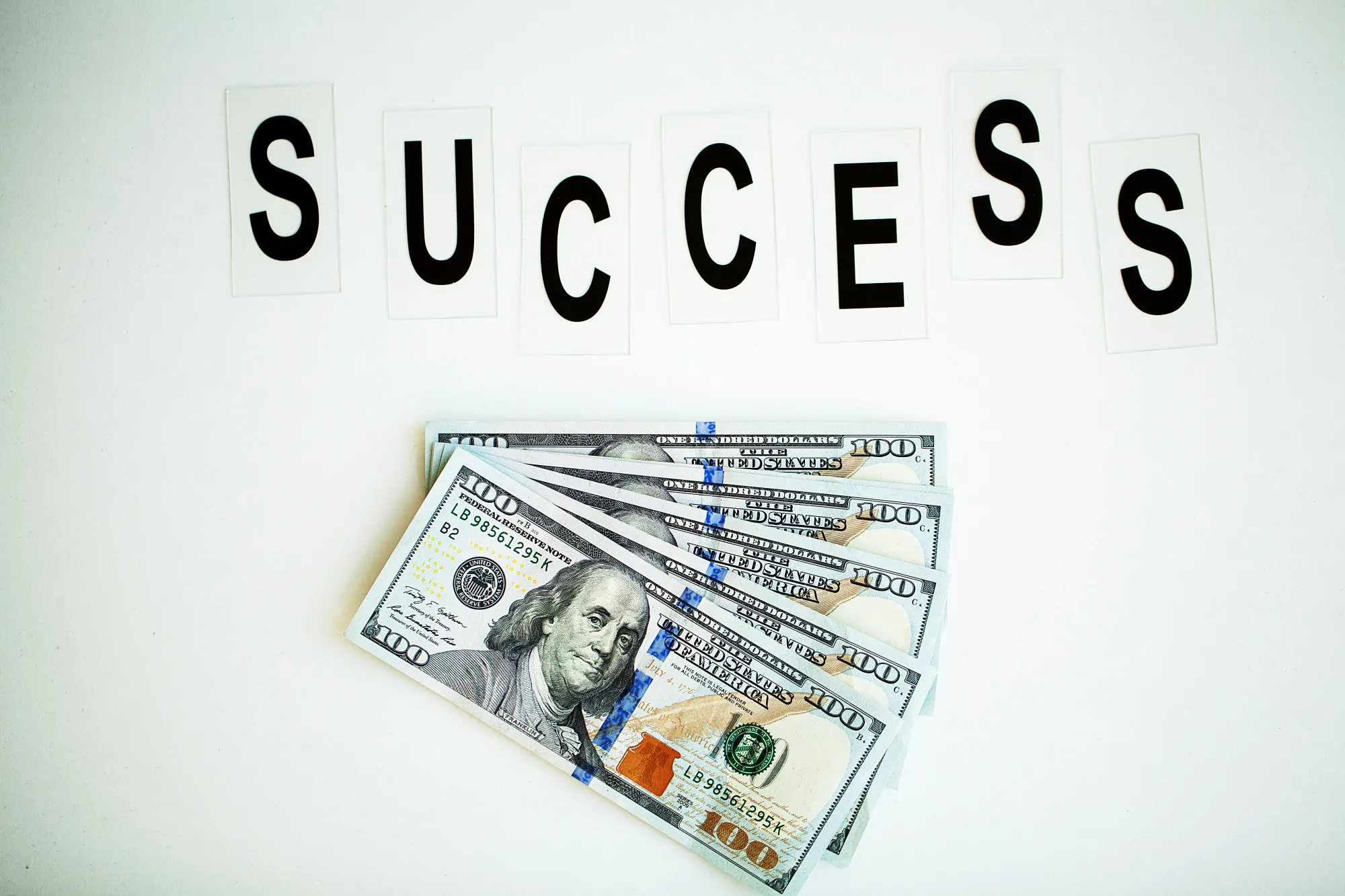 Success word written on white table.