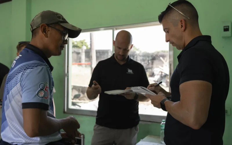 U.S. Marine Corps Maj. Thomas Myers, right, a civil affairs officer with 3rd Civil Affairs Group, Force Headquarters Group, Ryan Davis, center, a power system engineer with Idaho National Laboratory, and Rodel Dilla, left, the acting officer in charge of Itbayat Diesel Power Plant, discuss Itbayat’s electrical power infrastructure during KAMANDAG 8 at Itbayat, Philippines, Oct. 15, 2024. KAMANDAG is an annual Philippine and U.S. Marine Corps-led exercise aimed at enhancing the Armed Forces of the Philippines’ defense and humanitarian capabilities by providing valuable training in combined operations with foreign militaries in the advancement of a Free and Open Indo-Pacific. This year marks the eighth iteration of this exercise and includes participants from the French Armed Forces, Royal Thai Marine Corps, and Indonesian Marine Corps; including continued participation from the Australian Defense Force, British Armed Forces, Japanese Ground Self-Defense Force, and Republic of Korea Marine Corps. (U.S. Marine Corps photo by Cpl. Bridgette Rodriguez)