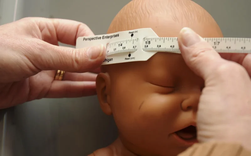Linda Mirehouse, Women, Infants and Childrean dietitian, demonstrates how to properly measure the diameter of a baby's head in the WIC office at Ellsworth Air Force Base, S.D., Nov. 1, 2012. One major type of nutrition risk that is recognized for WIC eligibility are medically-based risks such as anemia, underweight, overweight, history of pregnancy complications and poor pregnancy outcomes. (U.S. Air Force photo by Airman 1st Class Anania Tekurio/Released)