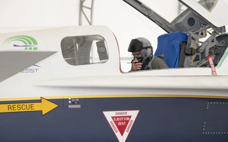 a pilot in uniform in a cockpit