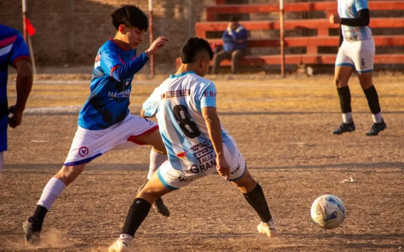 Dynamic soccer match as players compete vigorously on the field outdoors.