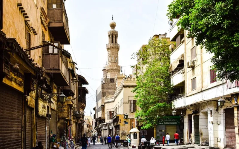 Explore the charm of a bustling historic street in Cairo with stunning architecture and cultural vibrancy.