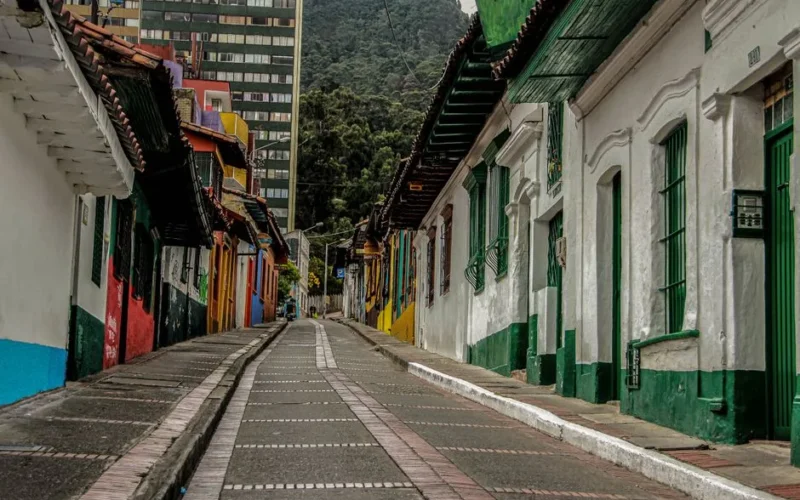 Vibrant colonial houses line a quaint street in La Candelaria, Bogota, Colombia.